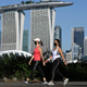 People make their way along the park connector at Marina Bay East in Singapore on August 9, 2021.